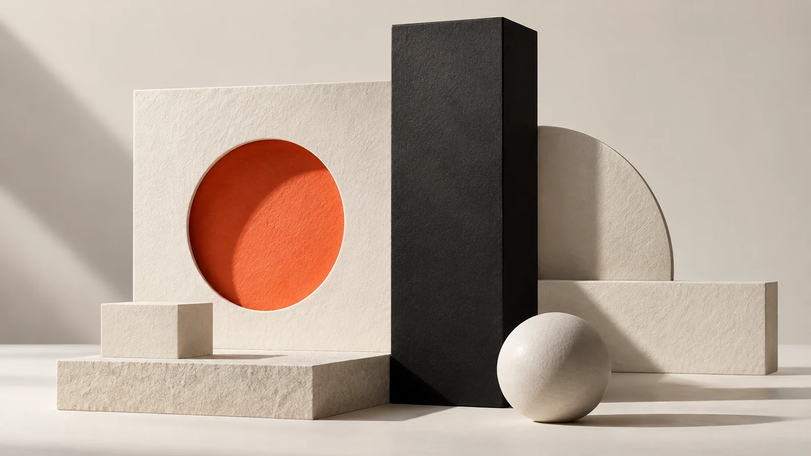 Abstract paper forms with a bold orange circle and black monolith.